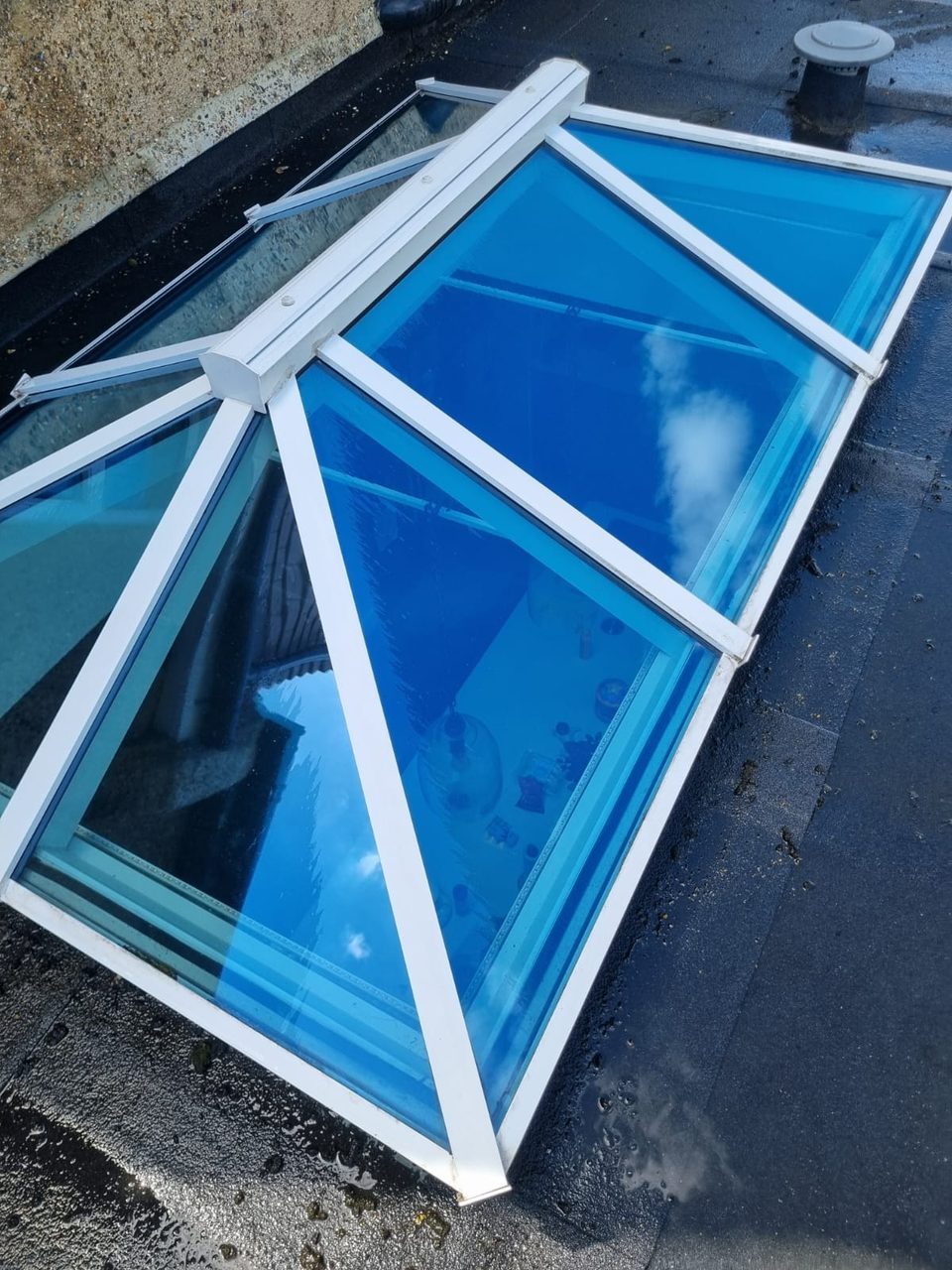 The lantern roof after cleaning, with clear glass and white frames